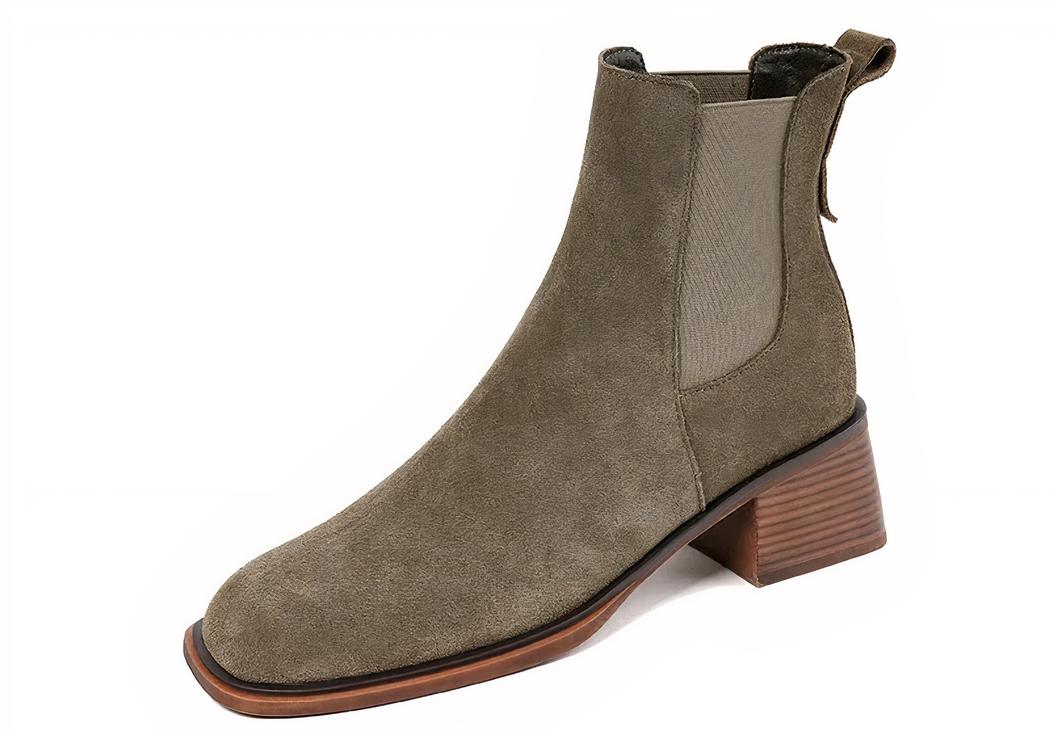 Boots santiag rétro en suède pour femme sur fond blanc